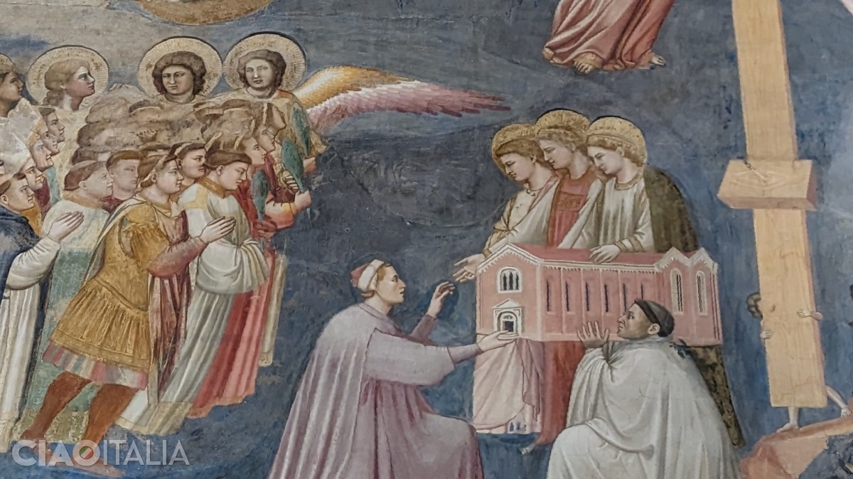 Enrico Scrovegni offers the Virgin Mary a model of the chapel.