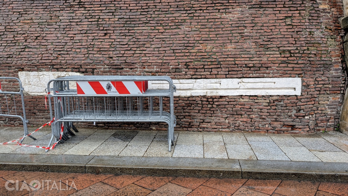 The old units of measurement from Bologna can still be seen on the wall of Palazzo d'Accursio.