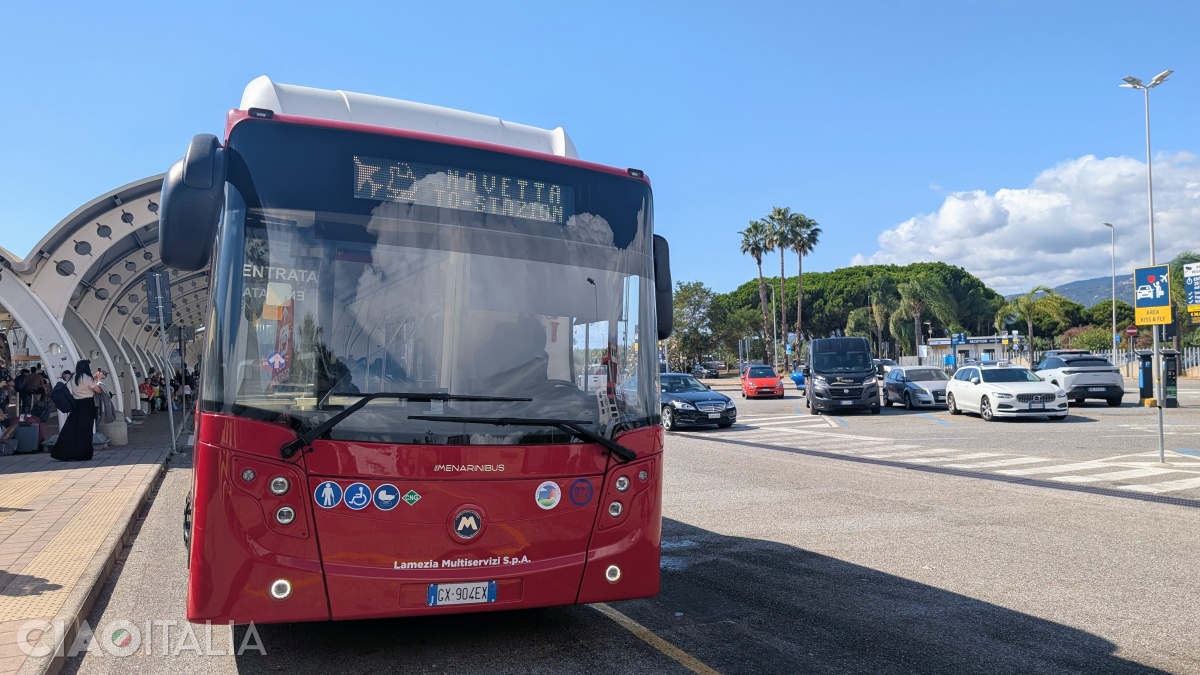 The bus station is located to the right of the airport exit.