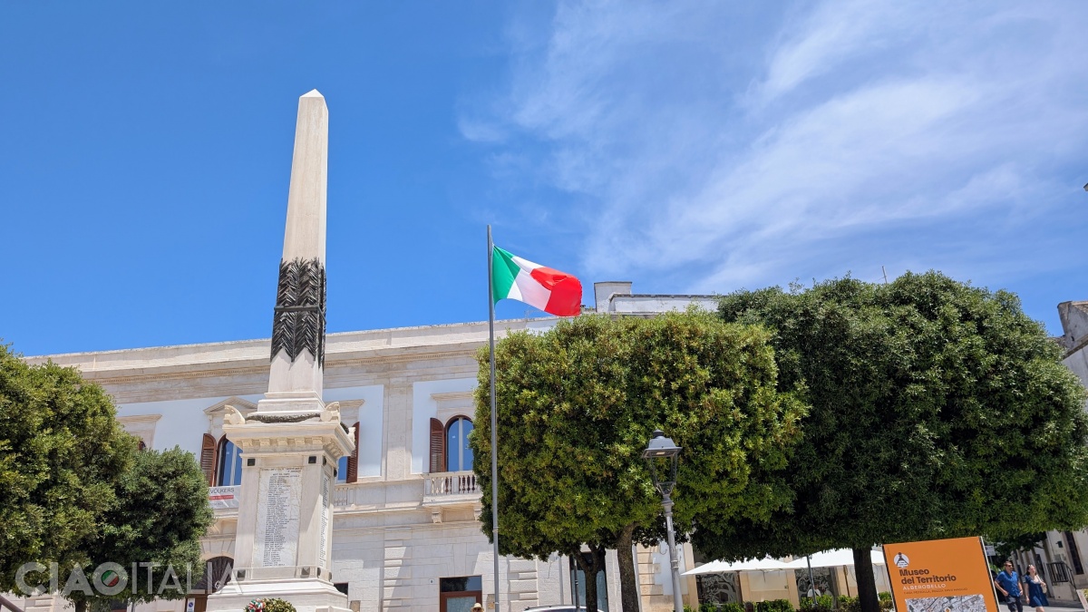 There is a war memorial in the middle of the square.