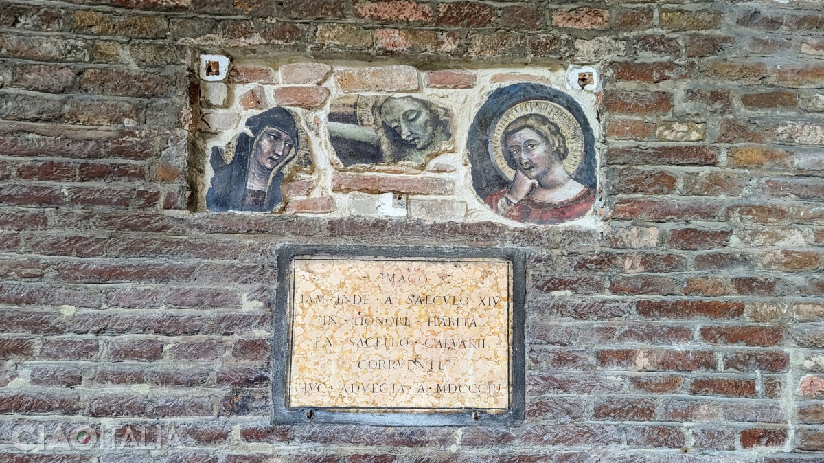 Fresco remnants depicting Jesus, the Virgin Mary, and Saint John the Baptist