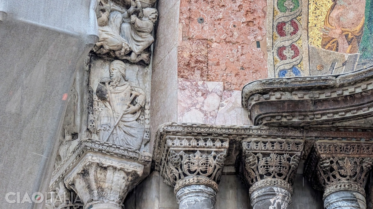 In the lower left part of the carved stone arch, the "unknown architect" of Basilica San Marco is depicted.