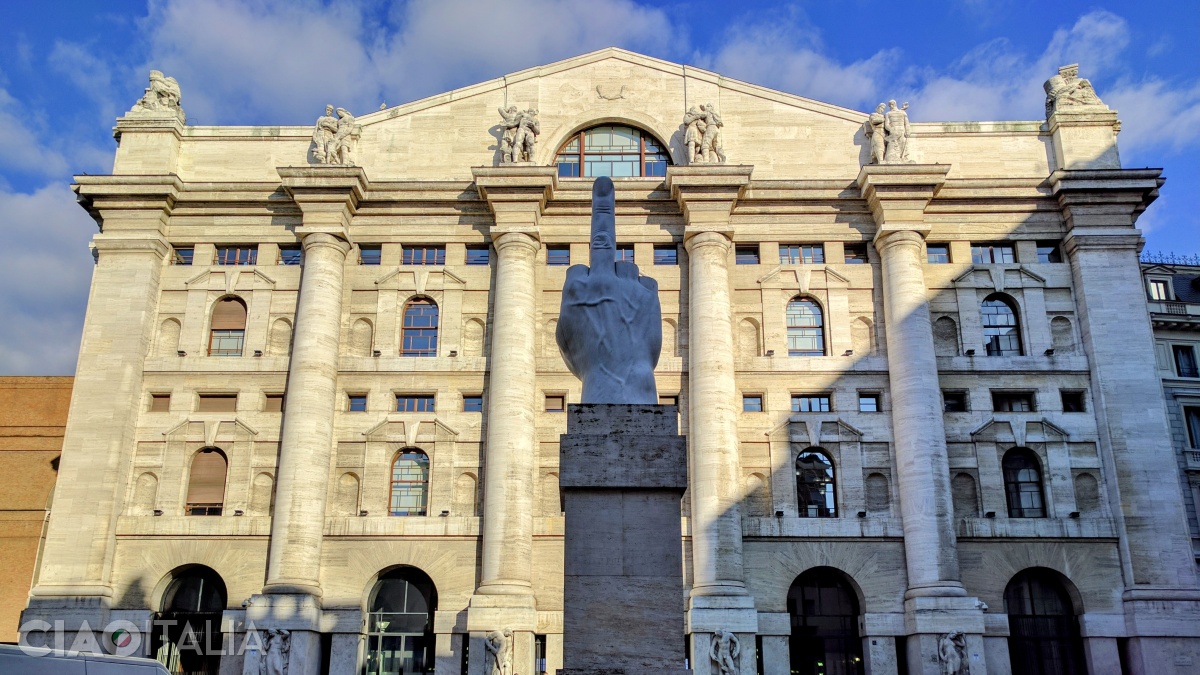 The sculpture L.O.V.E is in front of the Stock Exchange Building in Milan