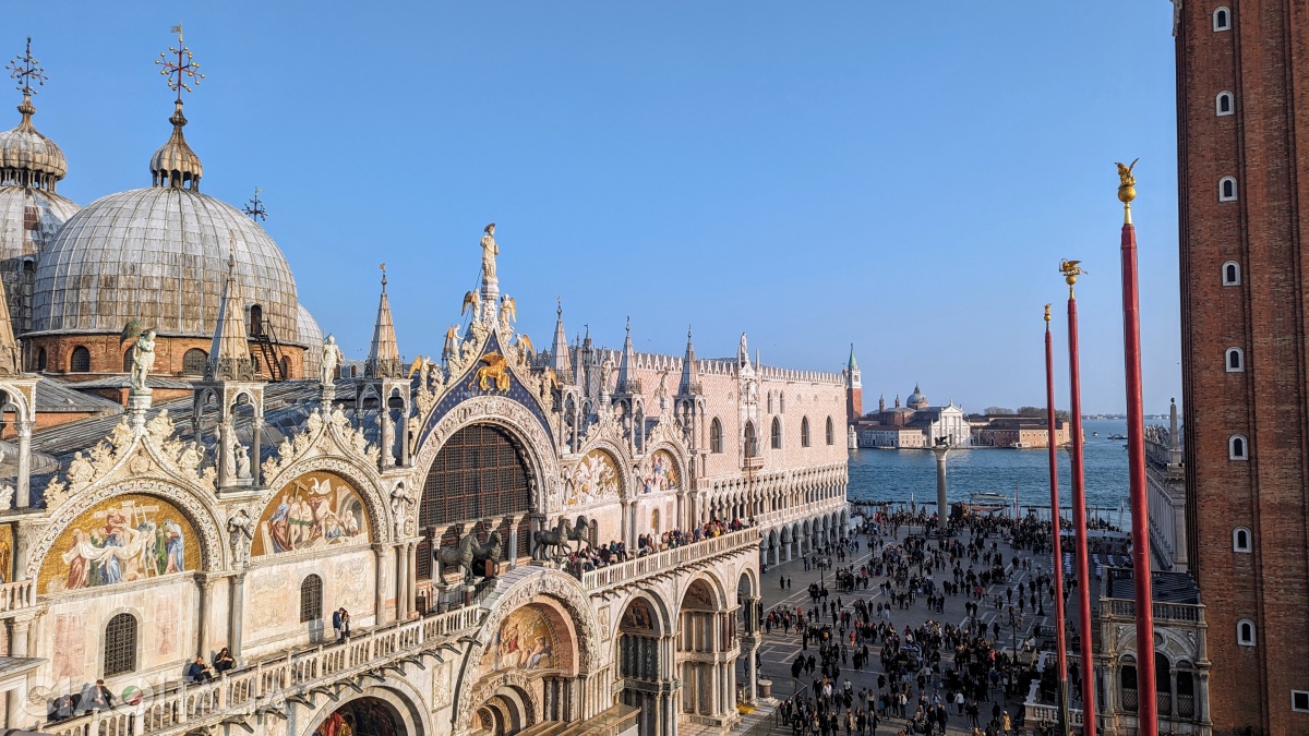 The three flagpoles (to the right) are the symbols of the three kingdoms conquered by the Venetians: Cyprus, Crete and Peloponnese.