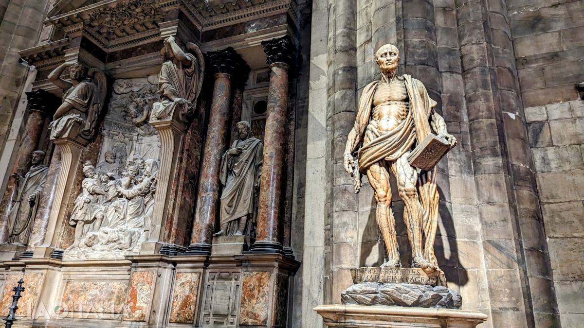 The statue of St. Bartholomew carrying his own skin on his shoulders is bound to impress you.
