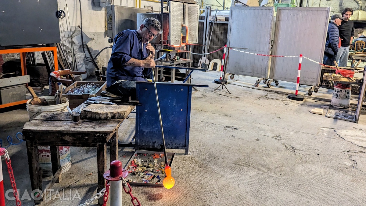 A glassmaker from Ellegi Murano Glass demonstrates the glassblowing technique.
