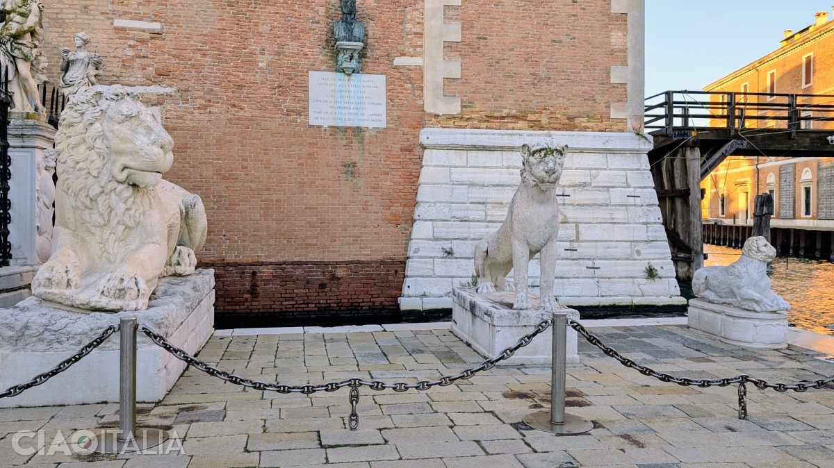 The statues of the three lions on the right side of the gate