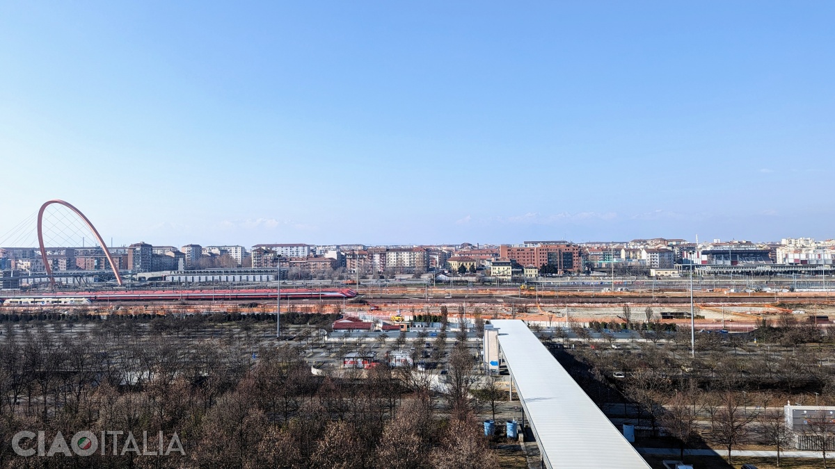 View of the city of Turin, with the Arch on the left and the peaks of the Alps in the distance.