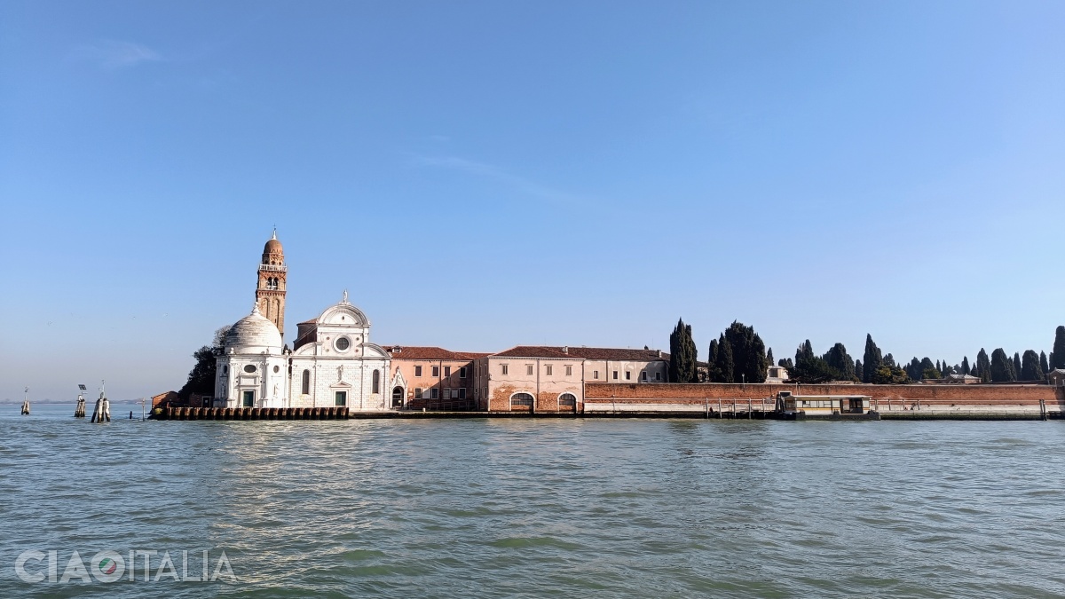 The white fa&ccedil;ade of the Church of San Michele contrasts with the red brick walls.