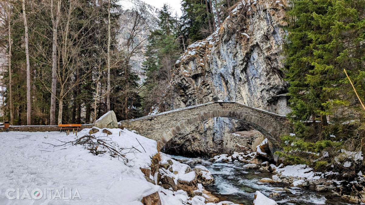 The old stone bridge over the Dora di Verney River