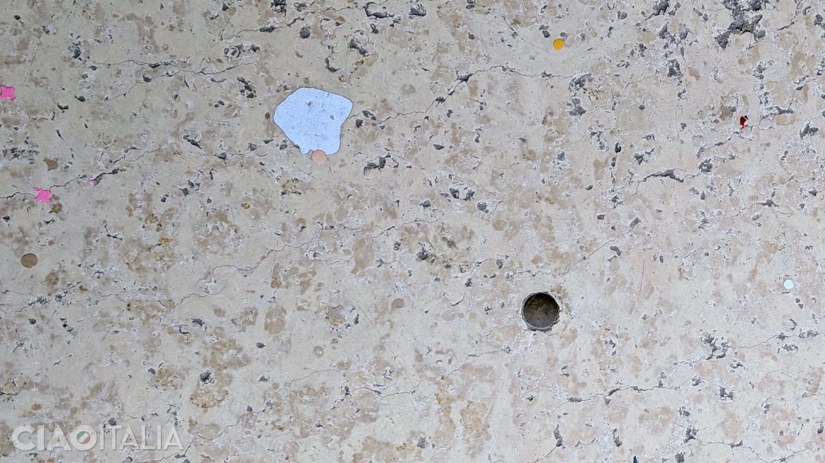 The small iron medallion set into the pavement marks the exact axis of St Mark's Basilica.