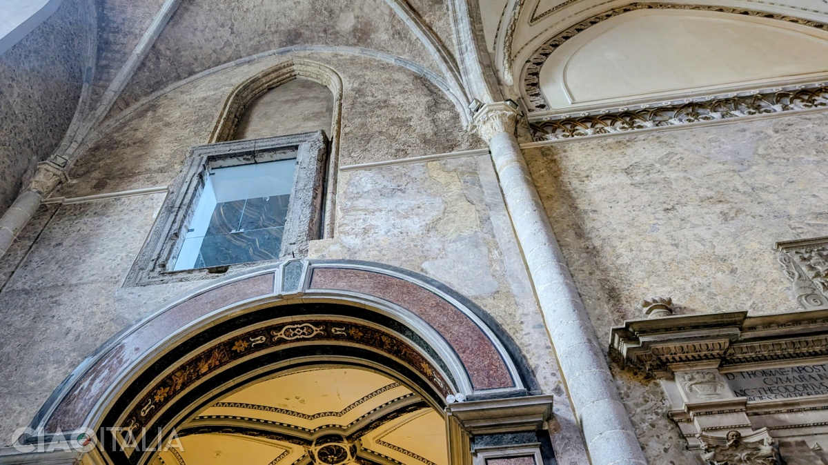 The window on the left side of the church, where the old chapel used to be