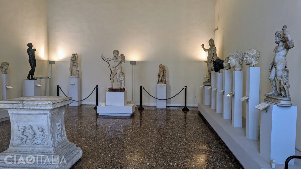 In the center: the statue of Eros with a bow, a Roman copy after a work by the Greek sculptor Lysippos (320 BC)