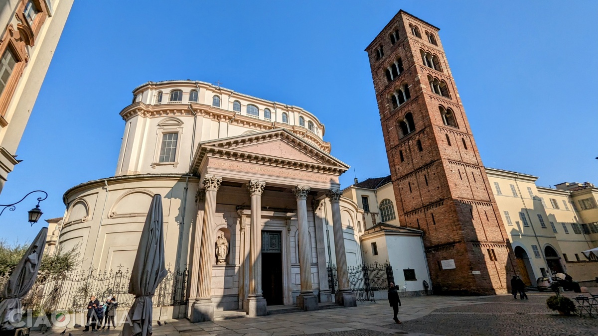 Chiesa della Consolata, with a neoclassical façade and a bell tower in Romanesque style.