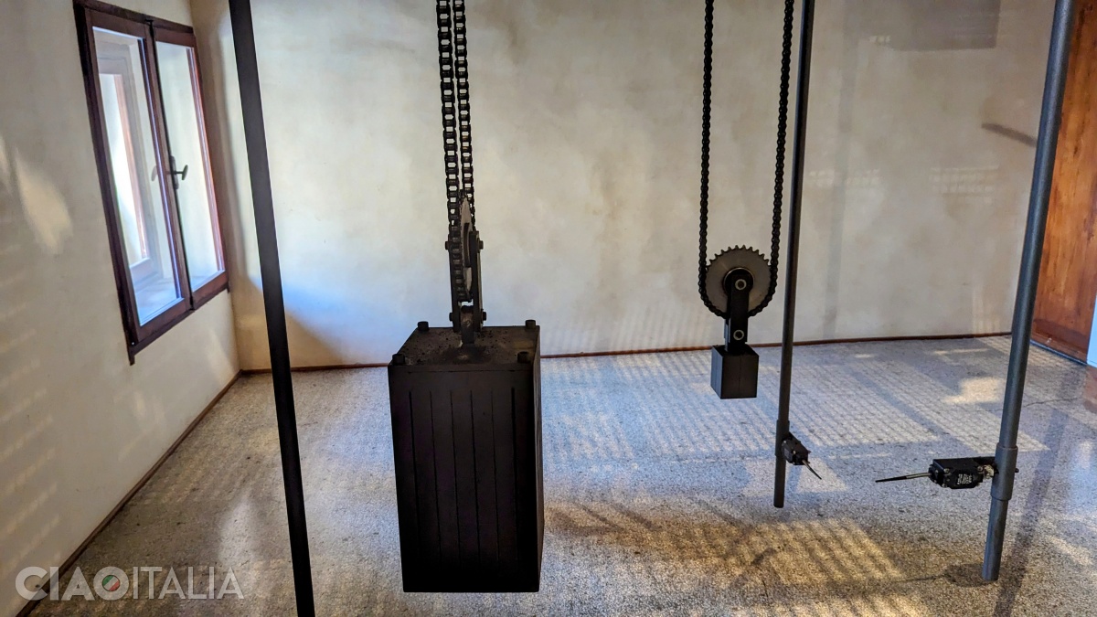 Pulleys and weights operate the clock mechanism.