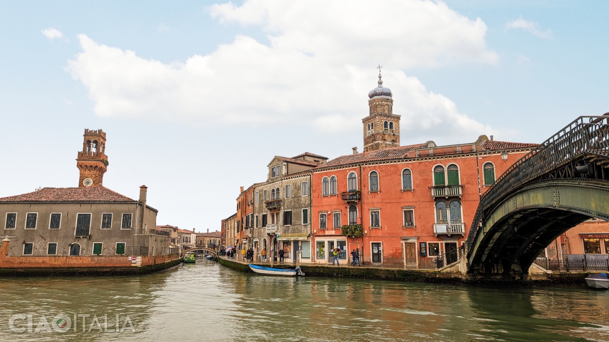 The Clock Tower (left) and the bell tower of the Church of San Pietro Martire (right)