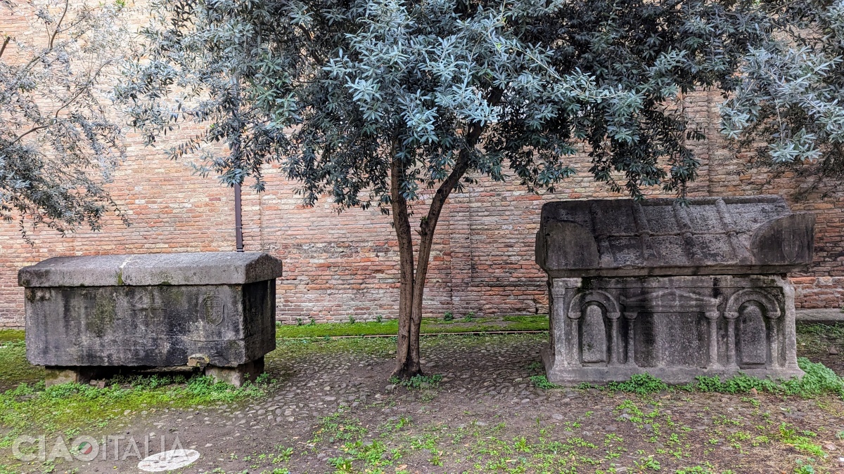 The two medieval sarcophagi in the church courtyard