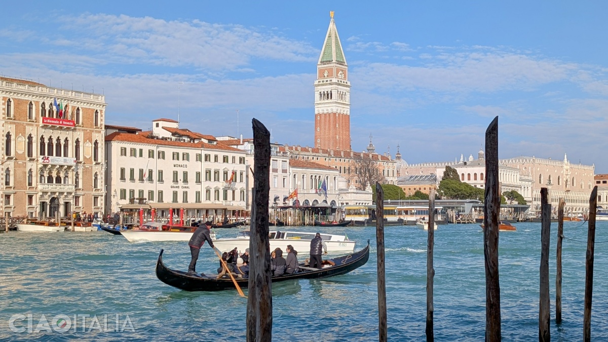 A "traghetto" gondola crosses the Grand Canal, from the Dogana to San Marco.