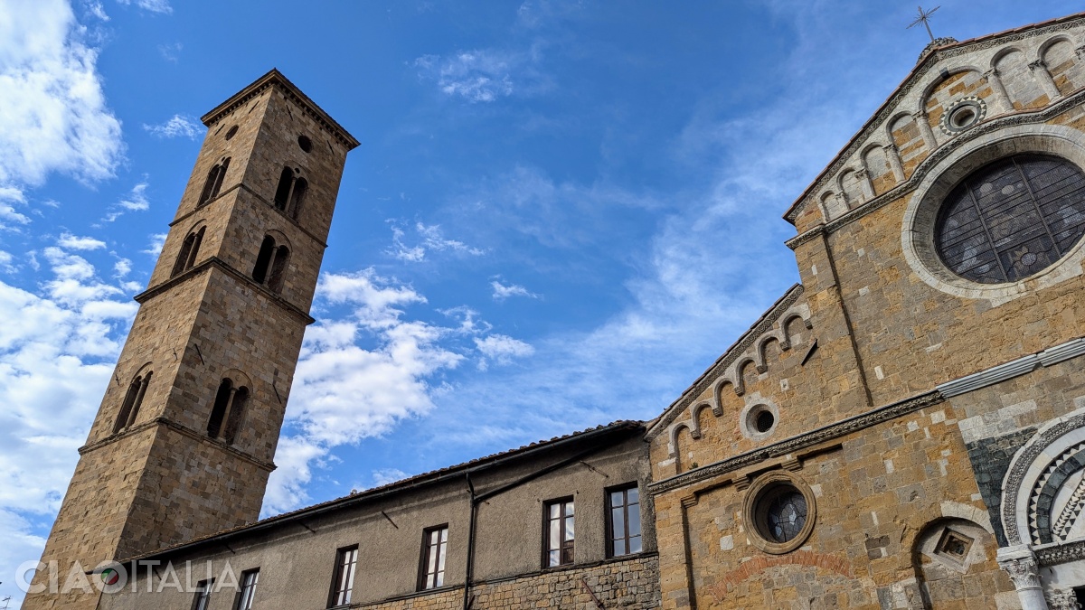 The church's bell tower is at a corner of the square.