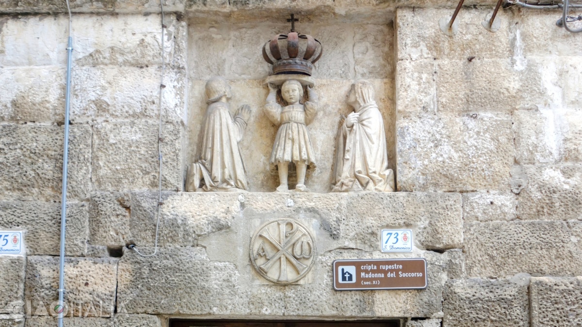 Above the entrance to the Crypt of Madonna del Soccorso is a sculpture by Stefano da Putignano.