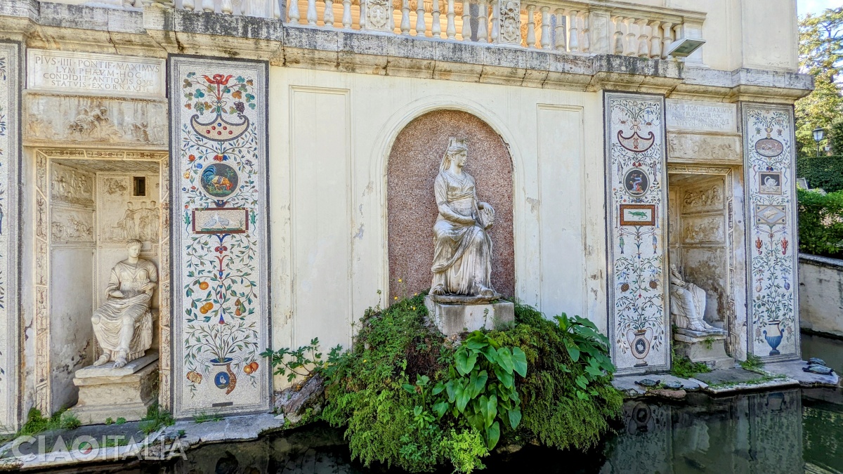 A fountain decorated with mosaics and statues