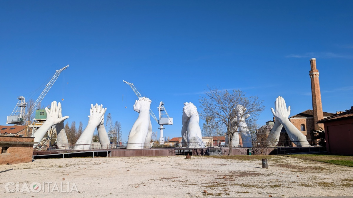 The six pairs of arms symbolize overcoming differences between people.