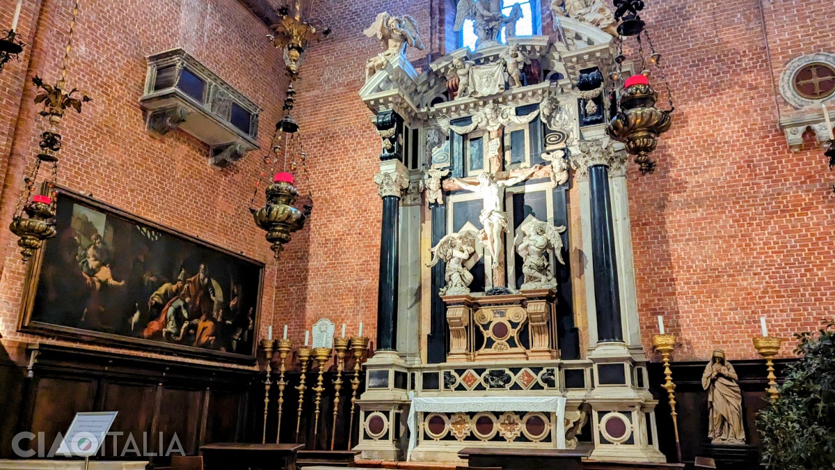 The Altar of the Crucifix is the first one on the left.