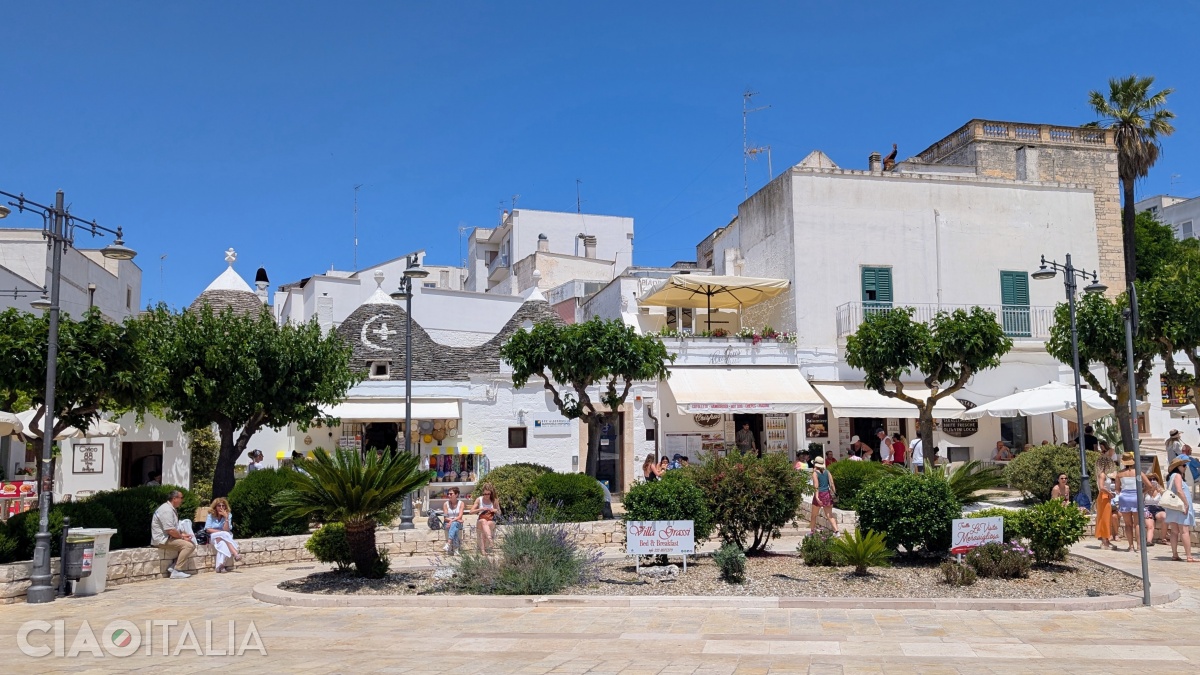 There are many bars and restaurants in the square.