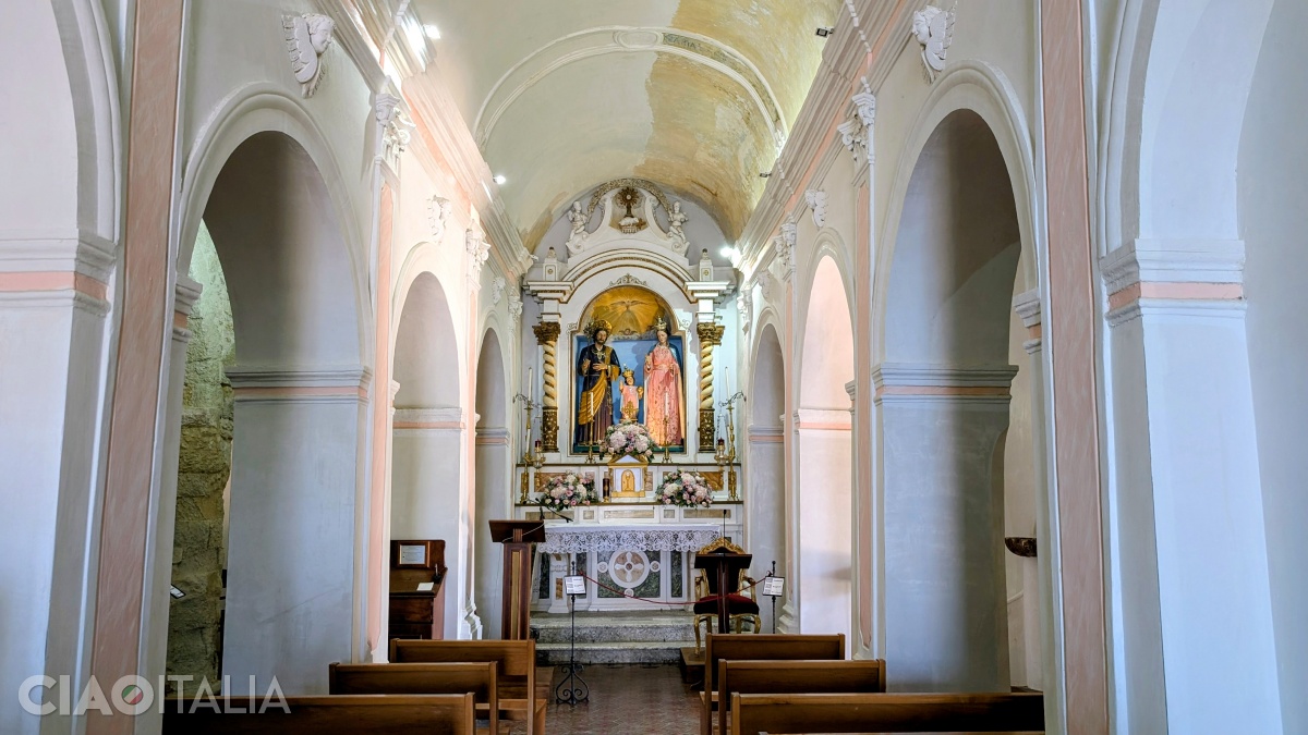 The interior of the church, with the wooden statues used in the August 15 procession.