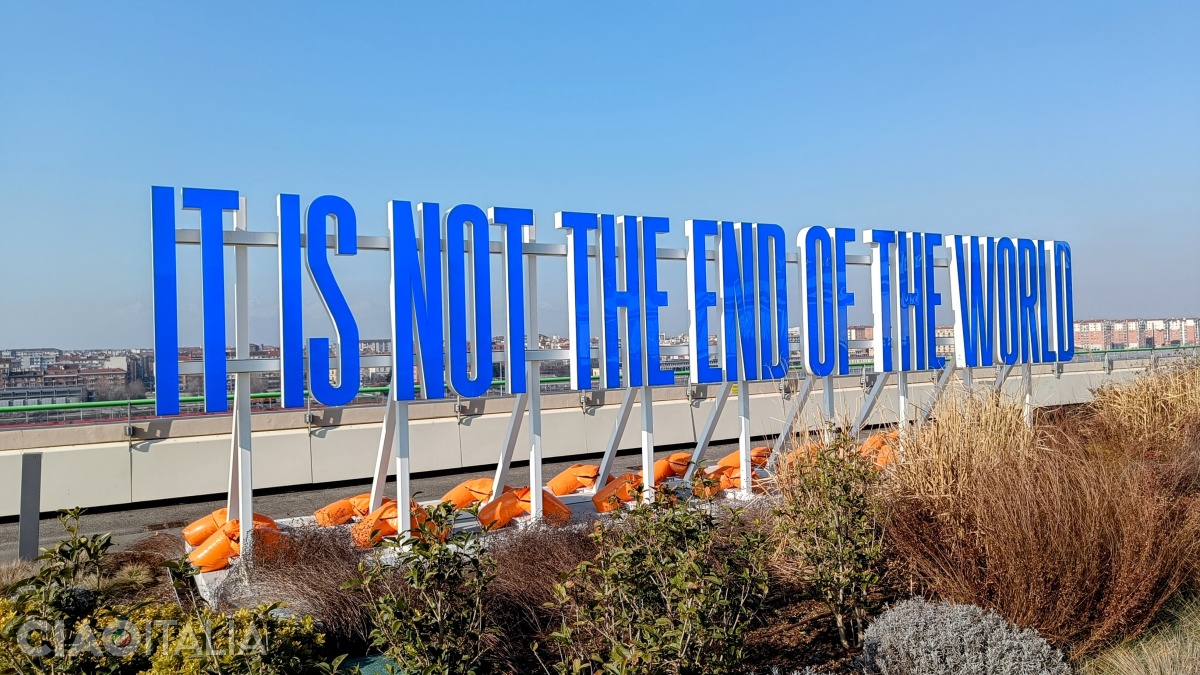 Art installation with illuminated letters: "It Is Not The End Of The World" (Superflex)