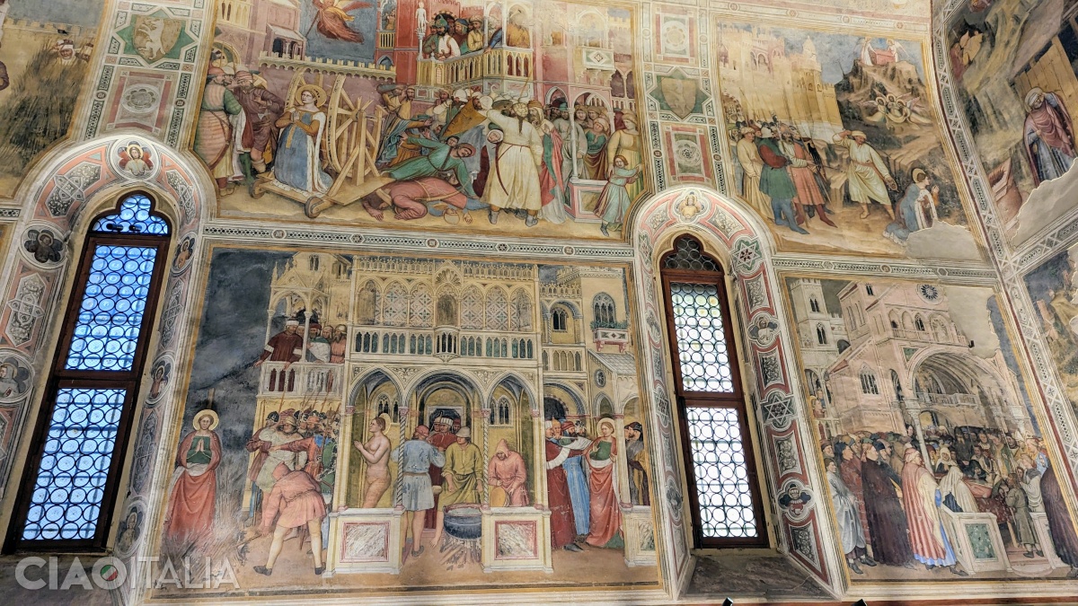 The scenes at the top depict the breaking on the wheel of Saint Catherine, followed by her beheading and burial on Mount Sinai.