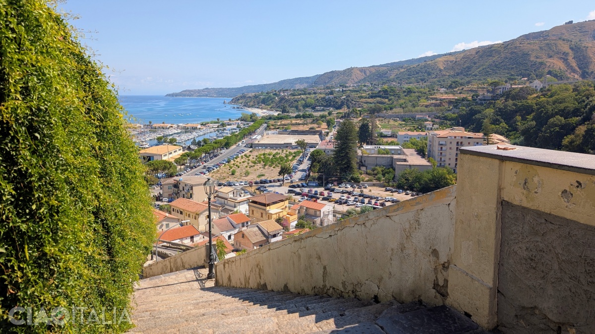 A staircase leads down to the beach.