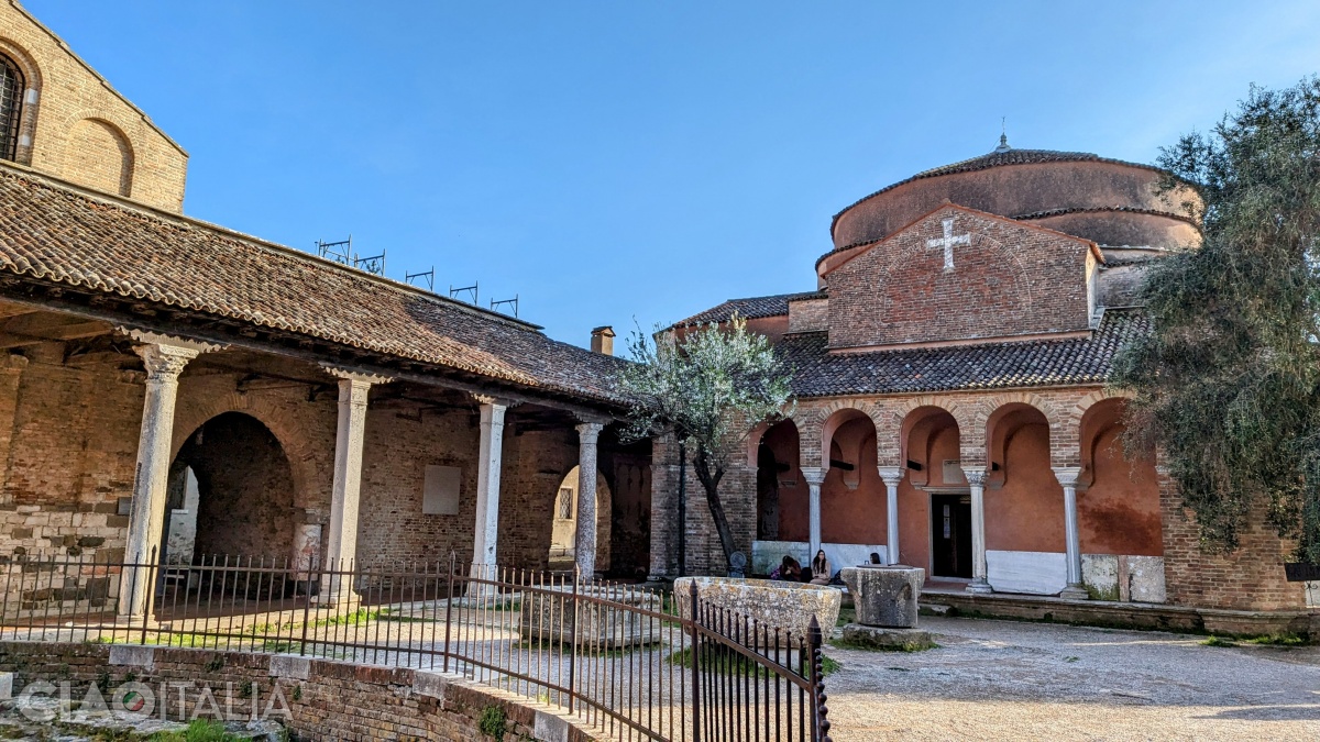 The Church of Santa Fosca is connected to the Basilica of Santa Maria Assunta by a gallery.