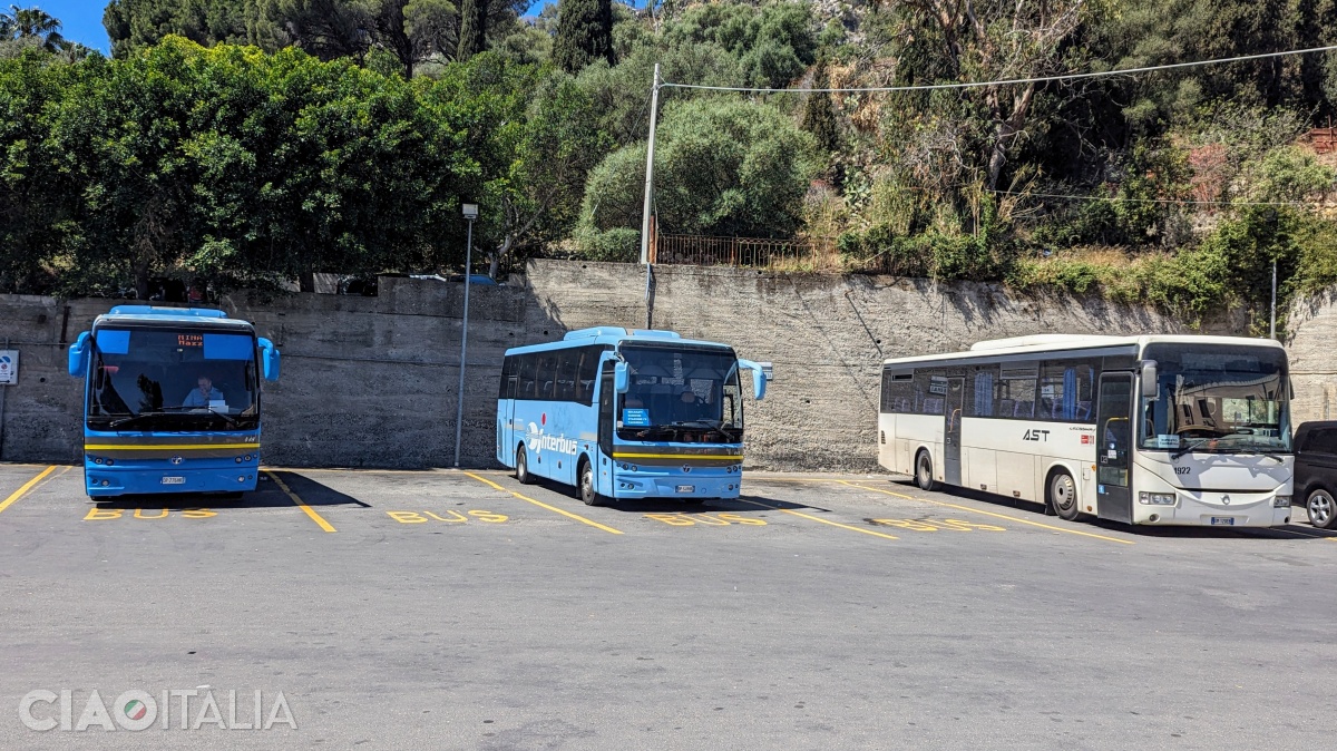 Interbus and Etna Trasporti buses stop at the bus station in Taormina.