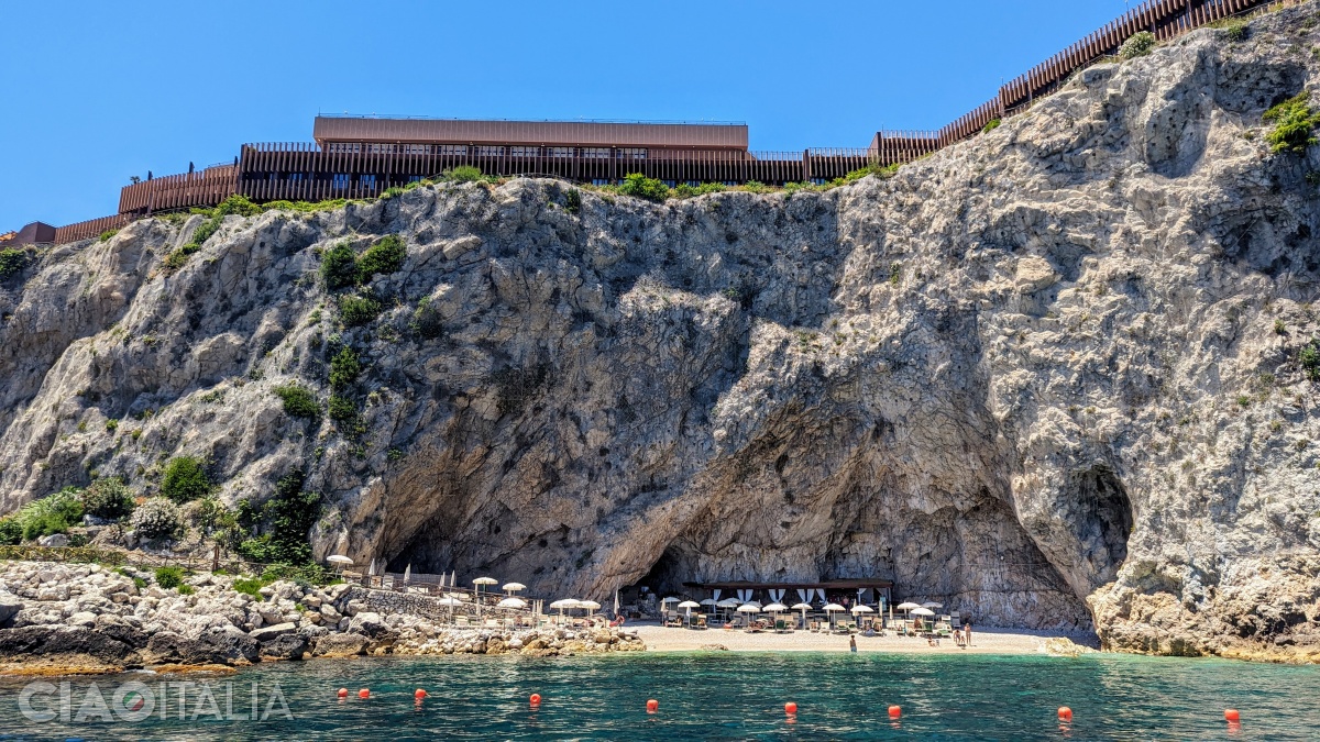The private beach can be reached by an elevator through a tunnel carved into the rock.