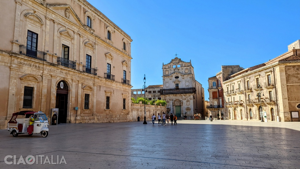 From left to right: the Archbishop's Palace, the Church of Santa Lucia alla Badia, and Palazzo Borgia del Casale.