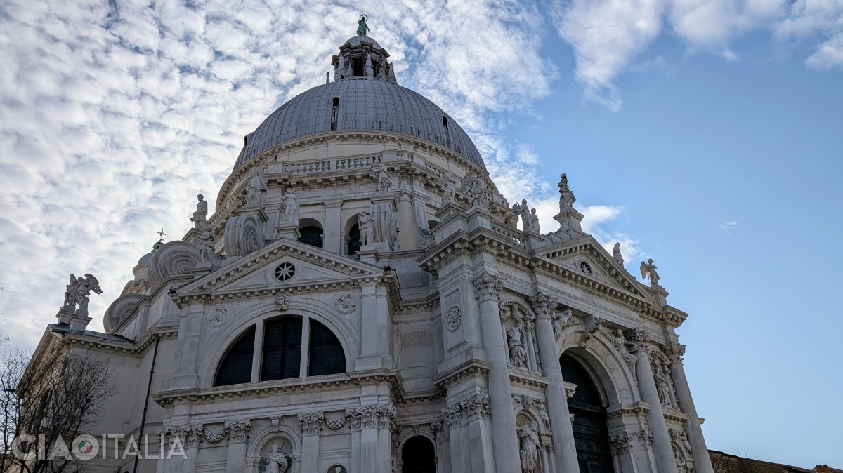 At the top of the main dome rises the statue of the Virgin.