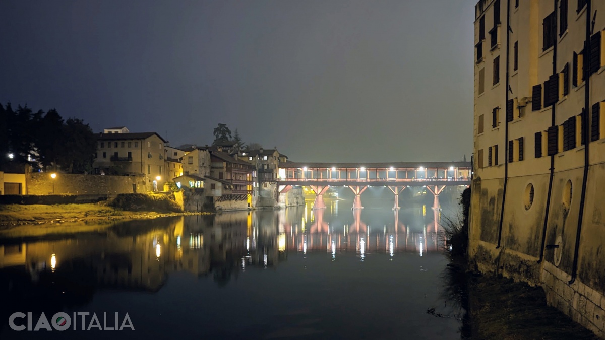 Ponte Vecchio is illuminated at night.