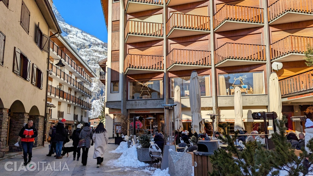 On Via Roma, you can take a walk or stop at a terrace.