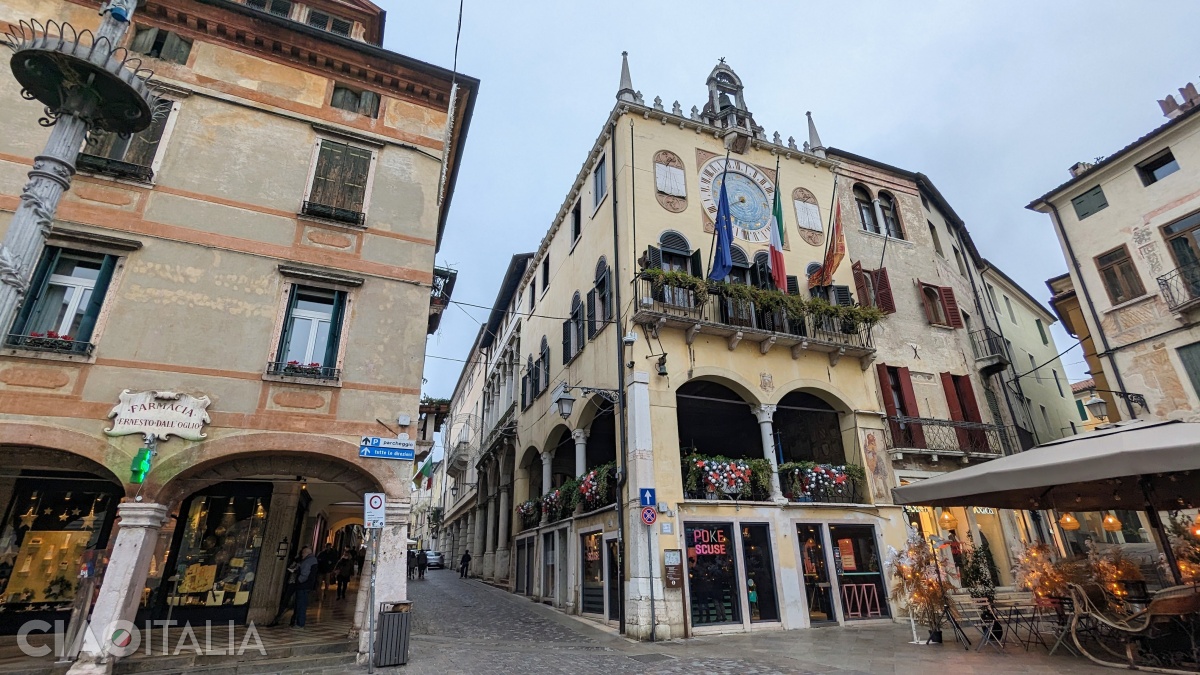 The Palazzo del Municipio (Town Hall) features a central loggia and a clock above it.