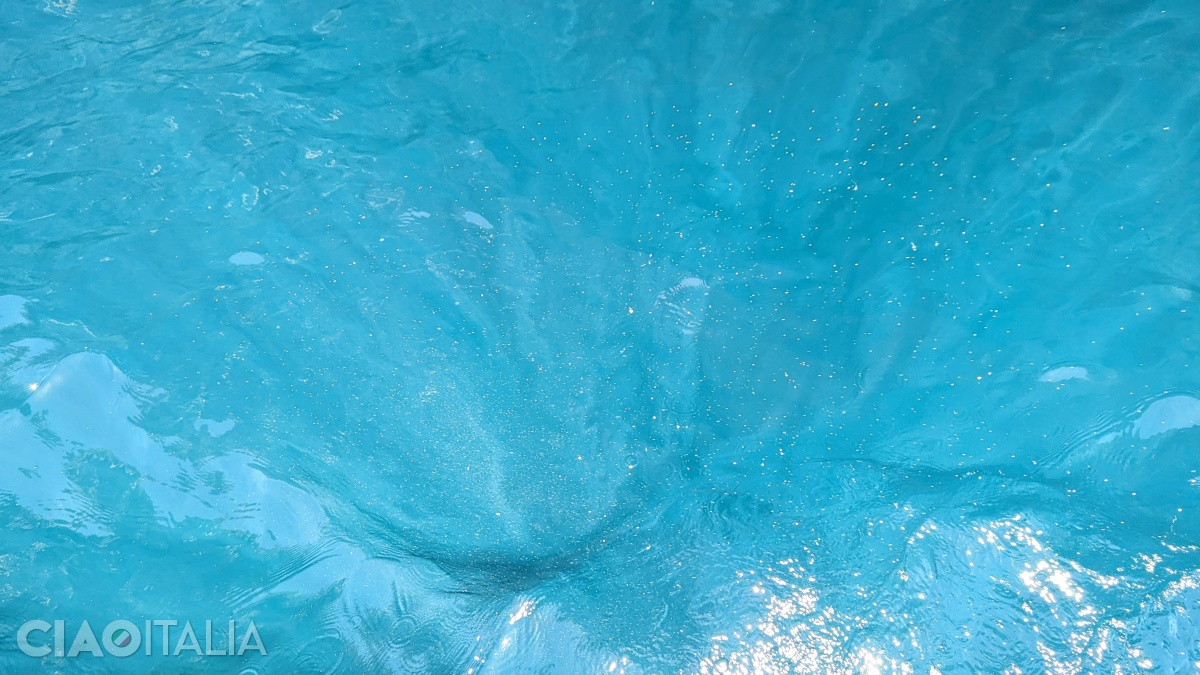 The sun's rays give the water an unreal color.