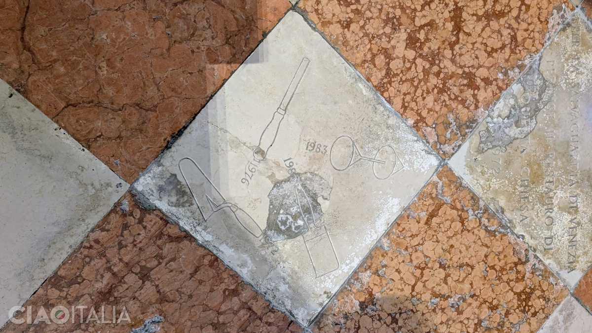 On the floor of the San Martino church, the tools of the Arsenal workers are engraved.