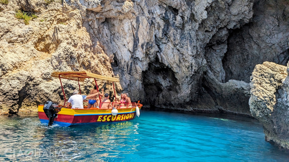 Boats cannot enter the grotto because of the rock wall, but they can get quite close.