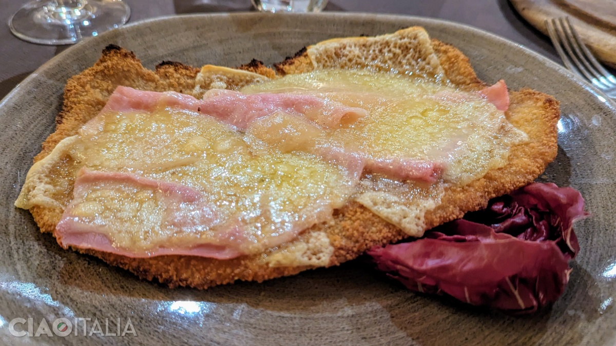 Cotoletta alla valdostana (the version in which ham and cheese are added on top of the fried meat)