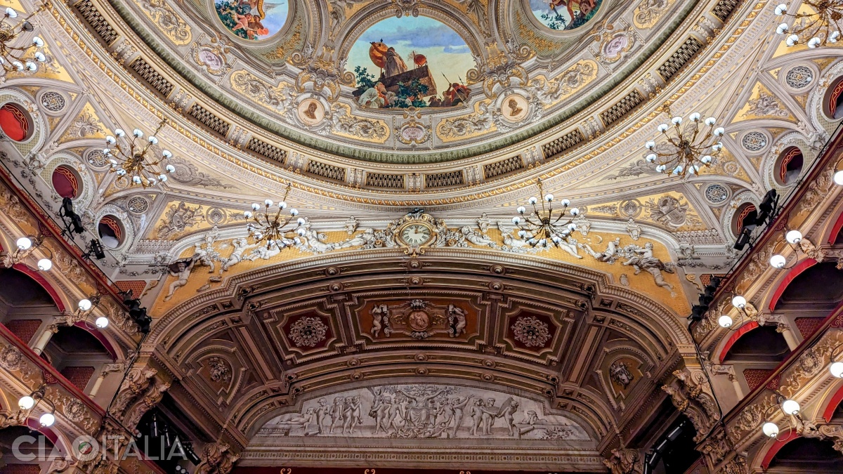 The stucco angels to the right and left of the clock symbolize day and night.