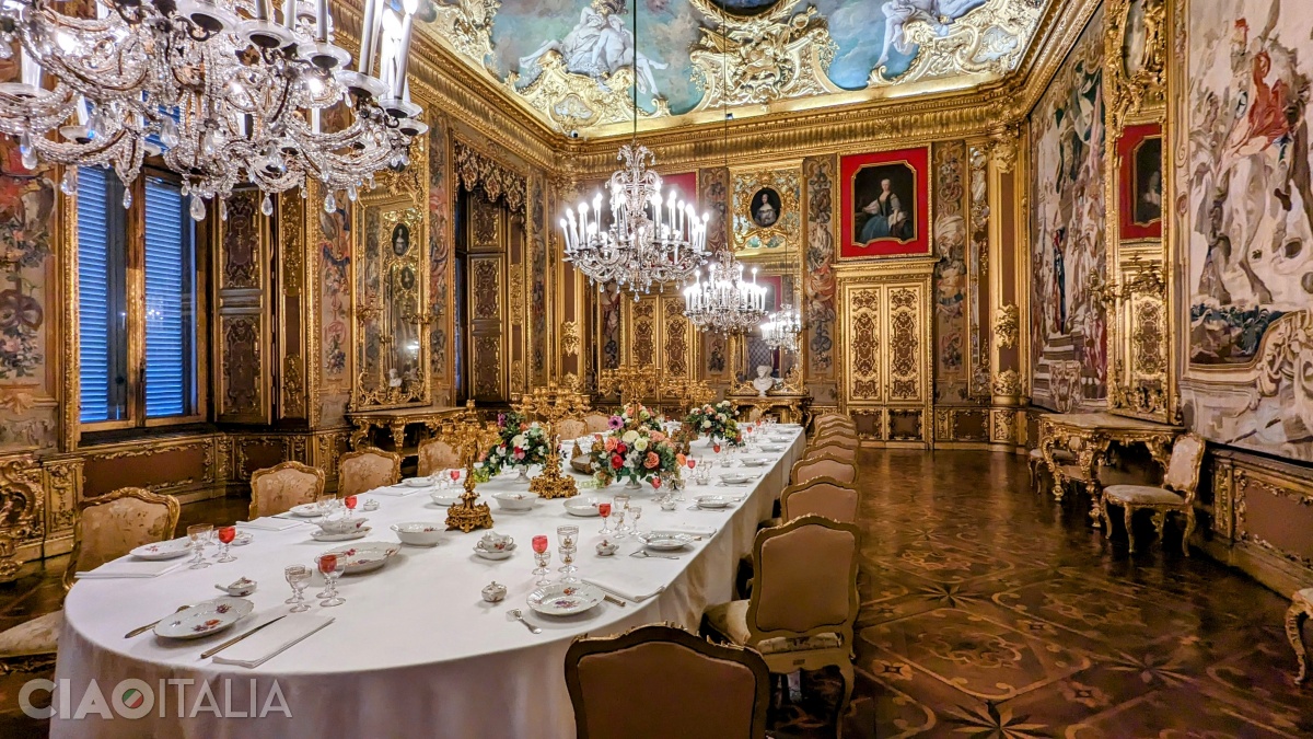 The Dining Room. The table is set with a porcelain dinner service and gilt bronze candelabras in the Neo-Baroque style.